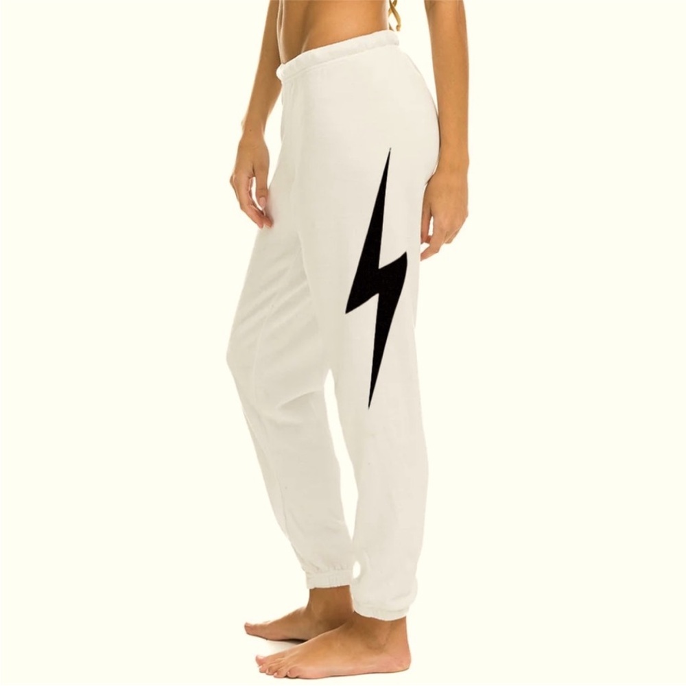 Aviator Nation ivory Joggers with Black Lightning Bolt